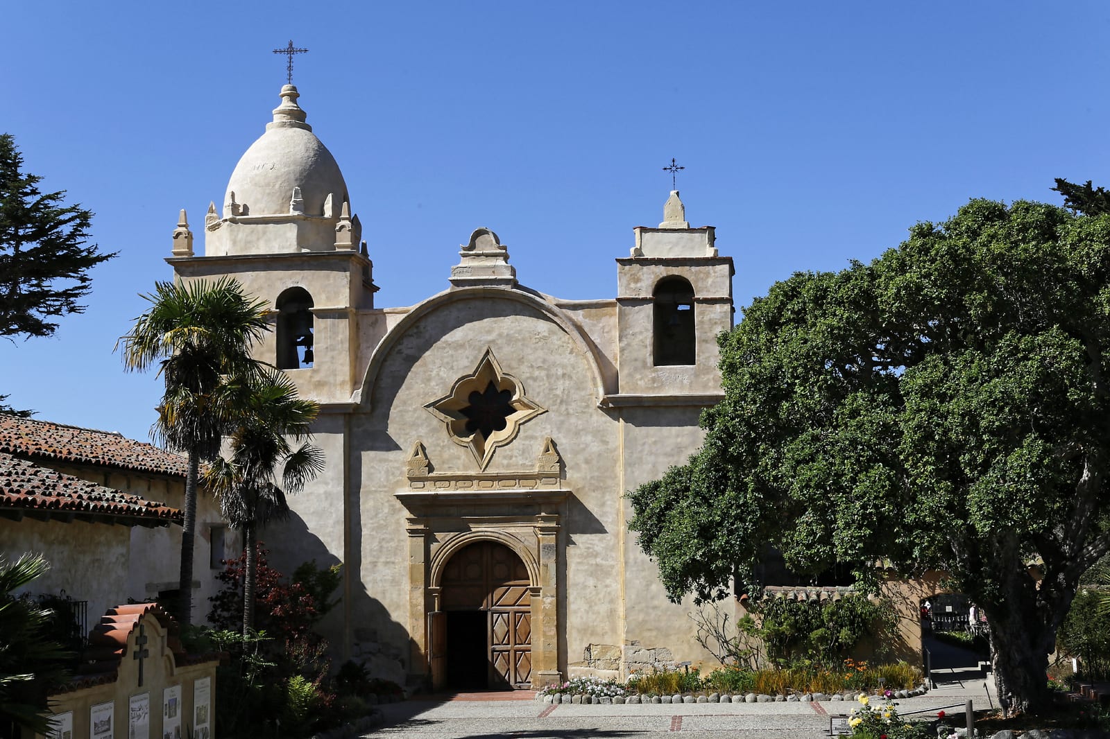 Facade and bell towers of Mission San Carlos Borromeo del Rio Carmelo in Carmel-by-the-Sea, California