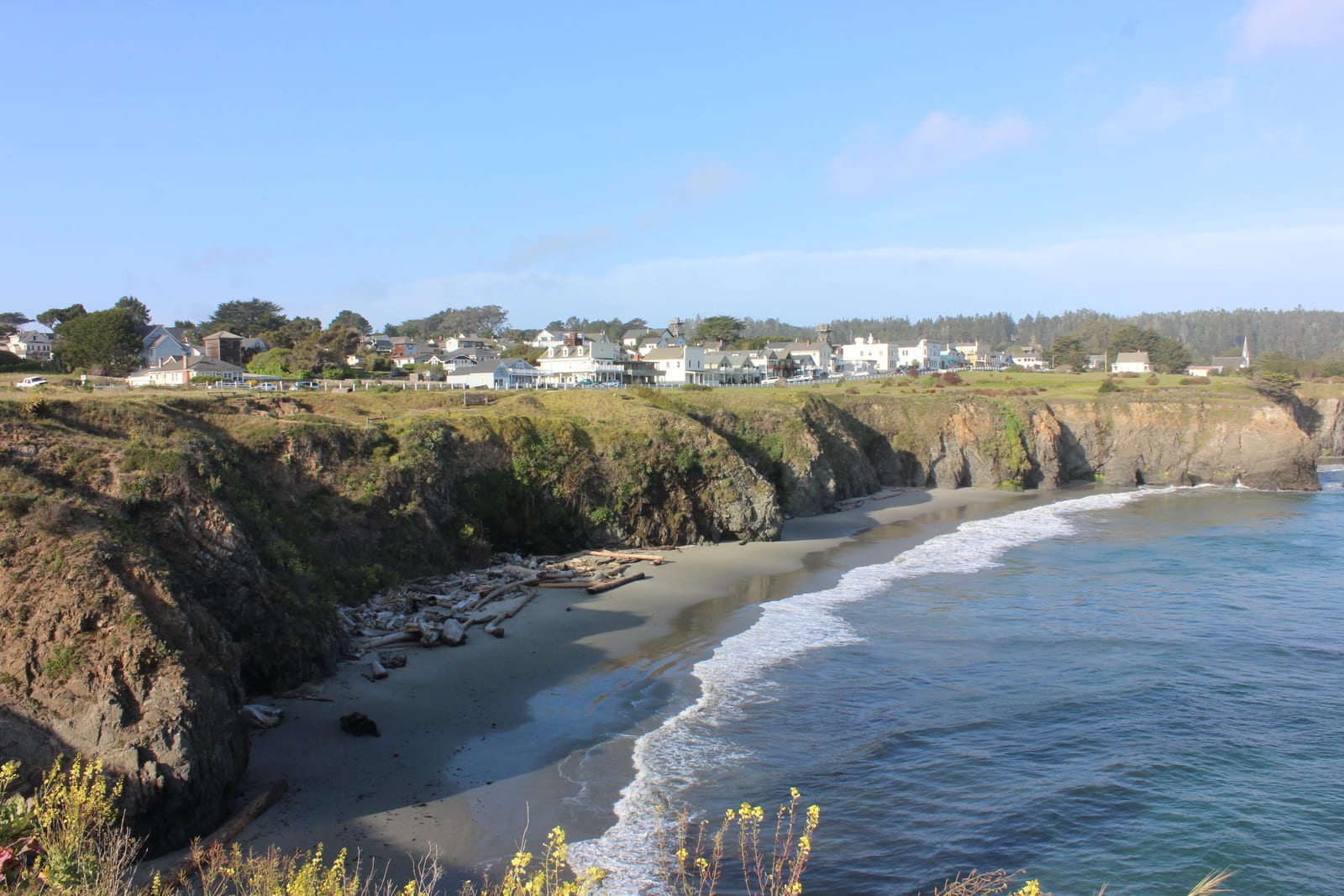 Mendocino village on the headland bluffs above a cove beach on the California North Coast